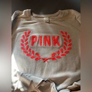 I’m selling a gray and neon pink sweater barely worn.